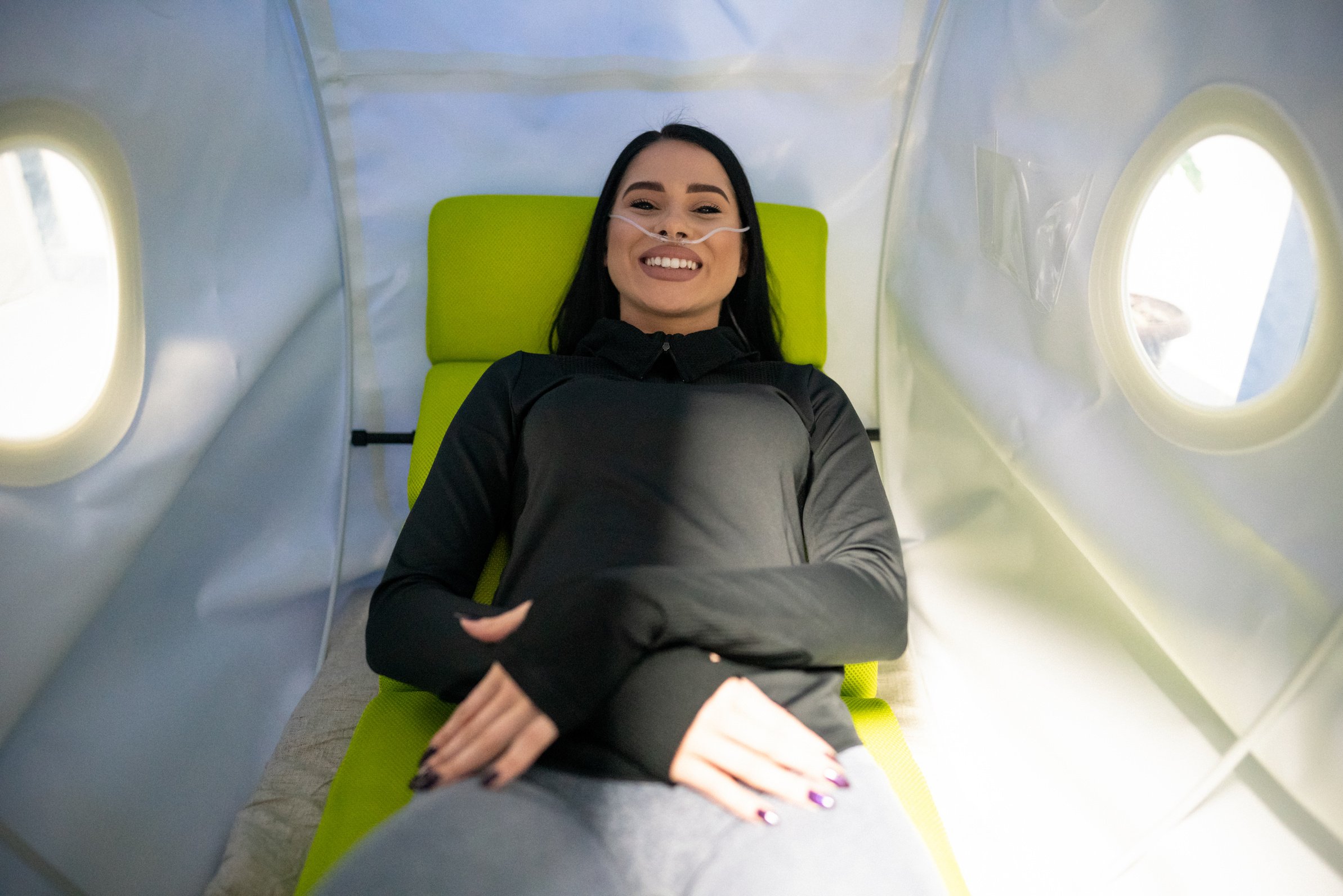Young woman on treatment in the hyperbaric oxygen chamber